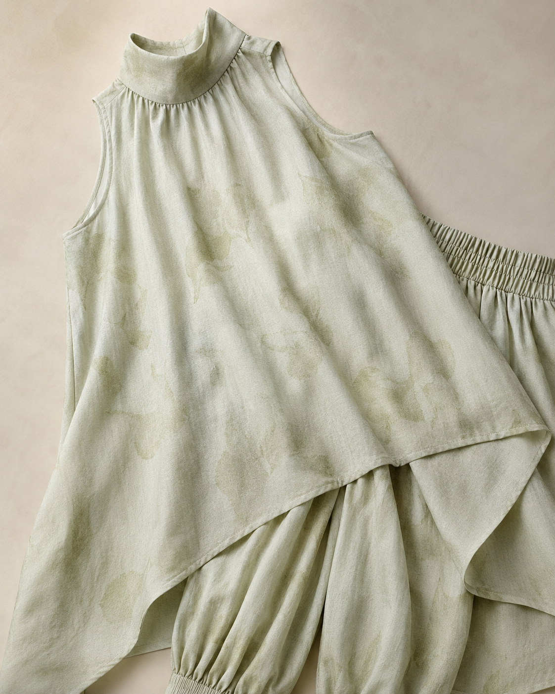 SHELLA — Ensemble vert sauge : tunique sans manches à col montant & ourlet asymétrique avec pantalon sarouel / Sage Green Asymmetrical Tunic & Harem Pants Co-Ord Set / طقم أخضر مريمي: تونيك بدون أكمام برقبة عالية وحاشية غير متماثلة وسروال هارم